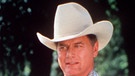 Serienfiesling J.R. Ewing mit Frau und Kind in der Serie "Dallas" | Bild: picture-alliance/dpa